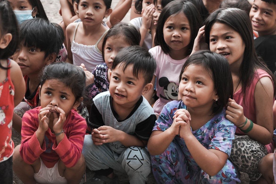 Group of children looking hopeful